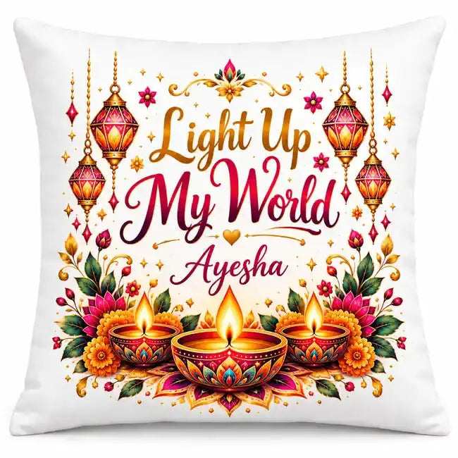 Personalised Diwali cushion featuring the Light Up My World message, custom name, colourful flowers, hanging lanterns and three glowing diyas