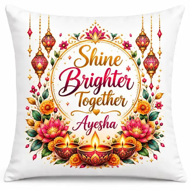 Personalised Diwali cushion with Shine Brighter Together quote, custom name, pink lotus flowers, hanging lanterns and three glowing oil lamps