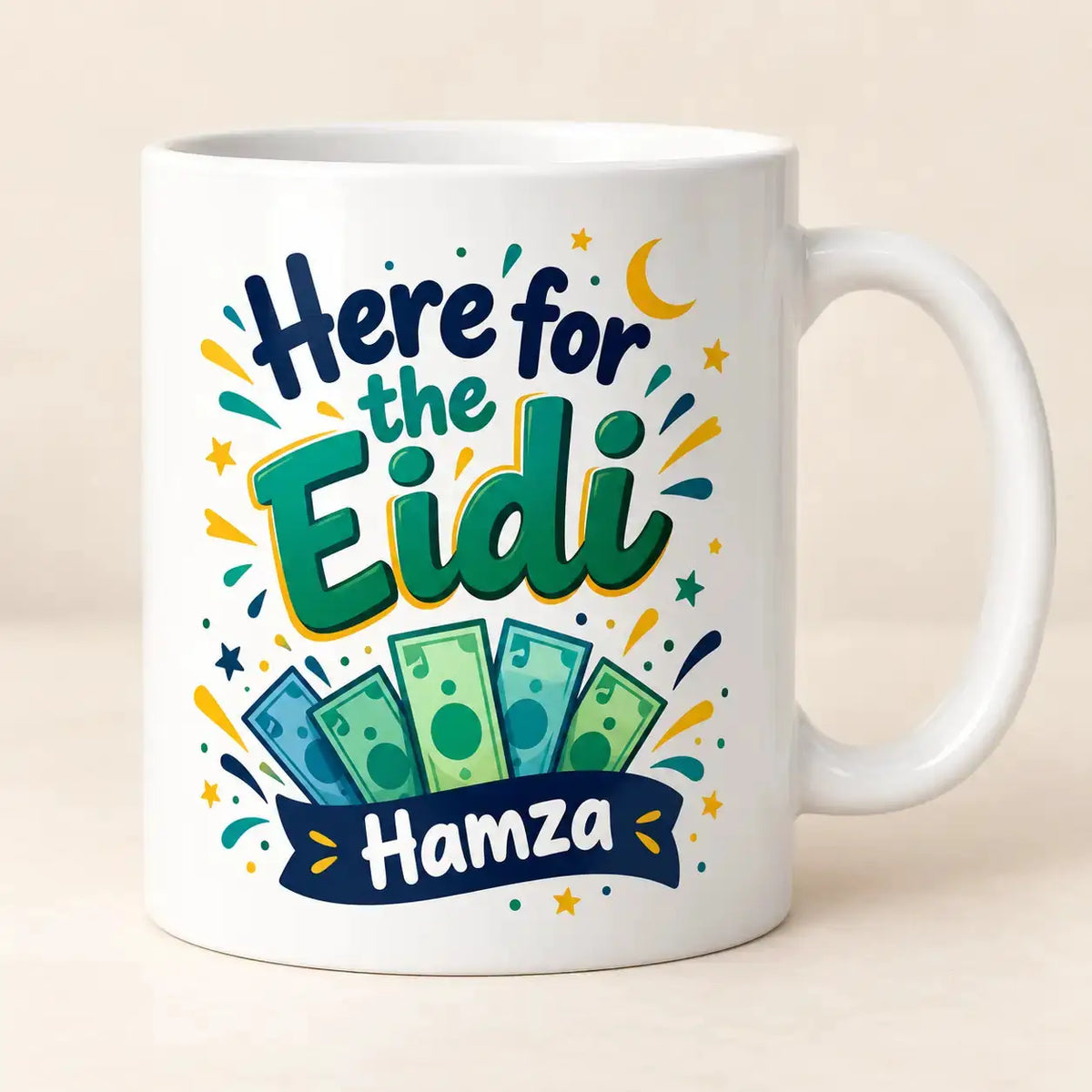 Personalised Here for the Eidi mug with colourful lettering, illustrated money notes, crescent moon and stars, customised with the name Hamza.