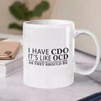 Personalised I Have CDO ceramic mug with funny OCD alphabetical order quote, a humorous gift for organised people and perfectionists.