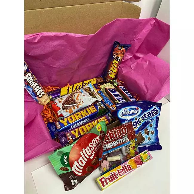 Assorted chocolate and sweet treats inside letterbox gift hamper