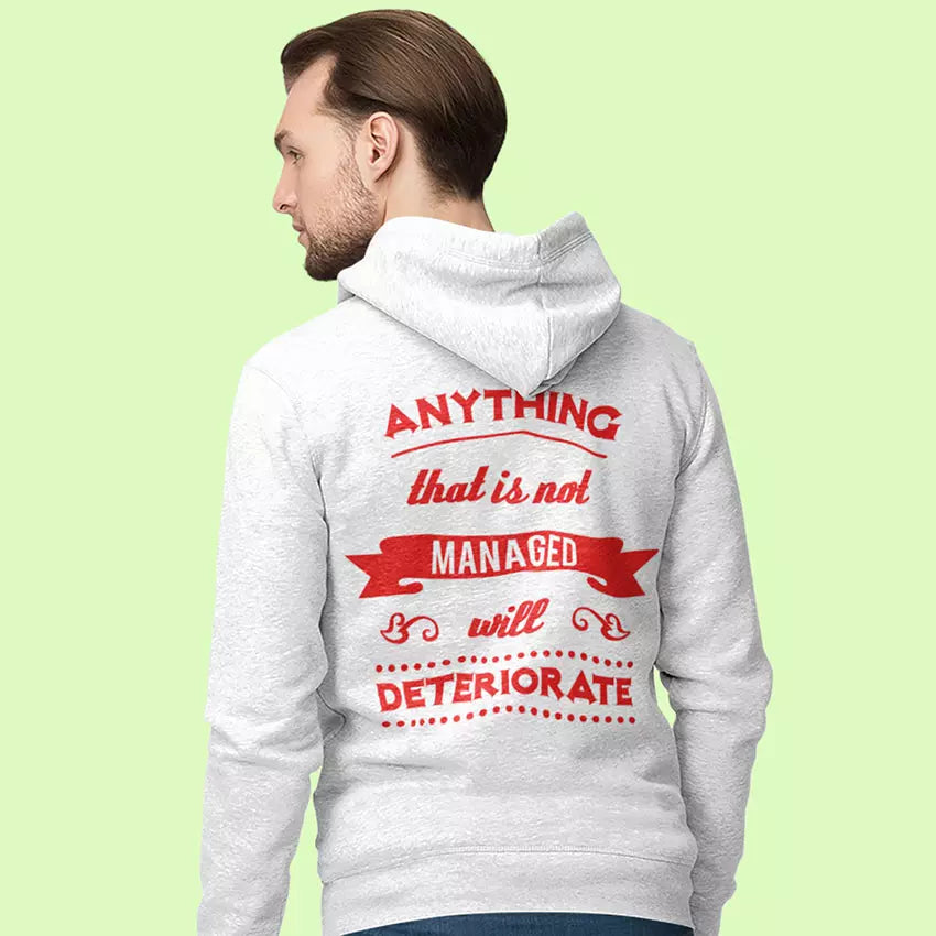 Person wearing a gray hoodie with red text on the back against a light green background