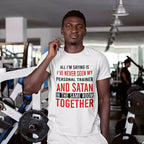 Personalised gym T-shirt featuring the funny quote about never seeing a personal trainer and Satan in the same room, with a custom name beneath the print.