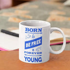 Personalised ceramic mug featuring the Born to Be Free Forever Young slogan with optional name or message on the reverse.