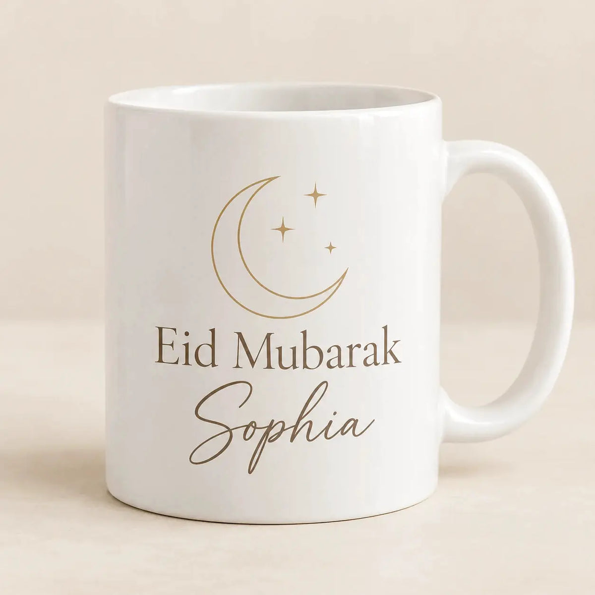 Personalised Eid Mubarak mug with custom name Sophia, elegant gold crescent moon and stars on a white ceramic mug.