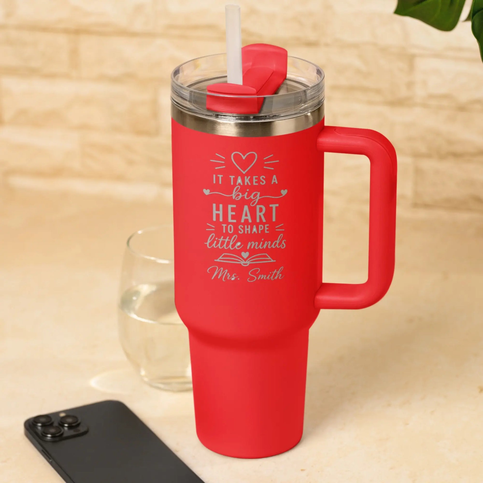 Personalised red teacher travel tumbler with engraved It Takes a Big Heart to Shape Little Minds design and custom teacher name.