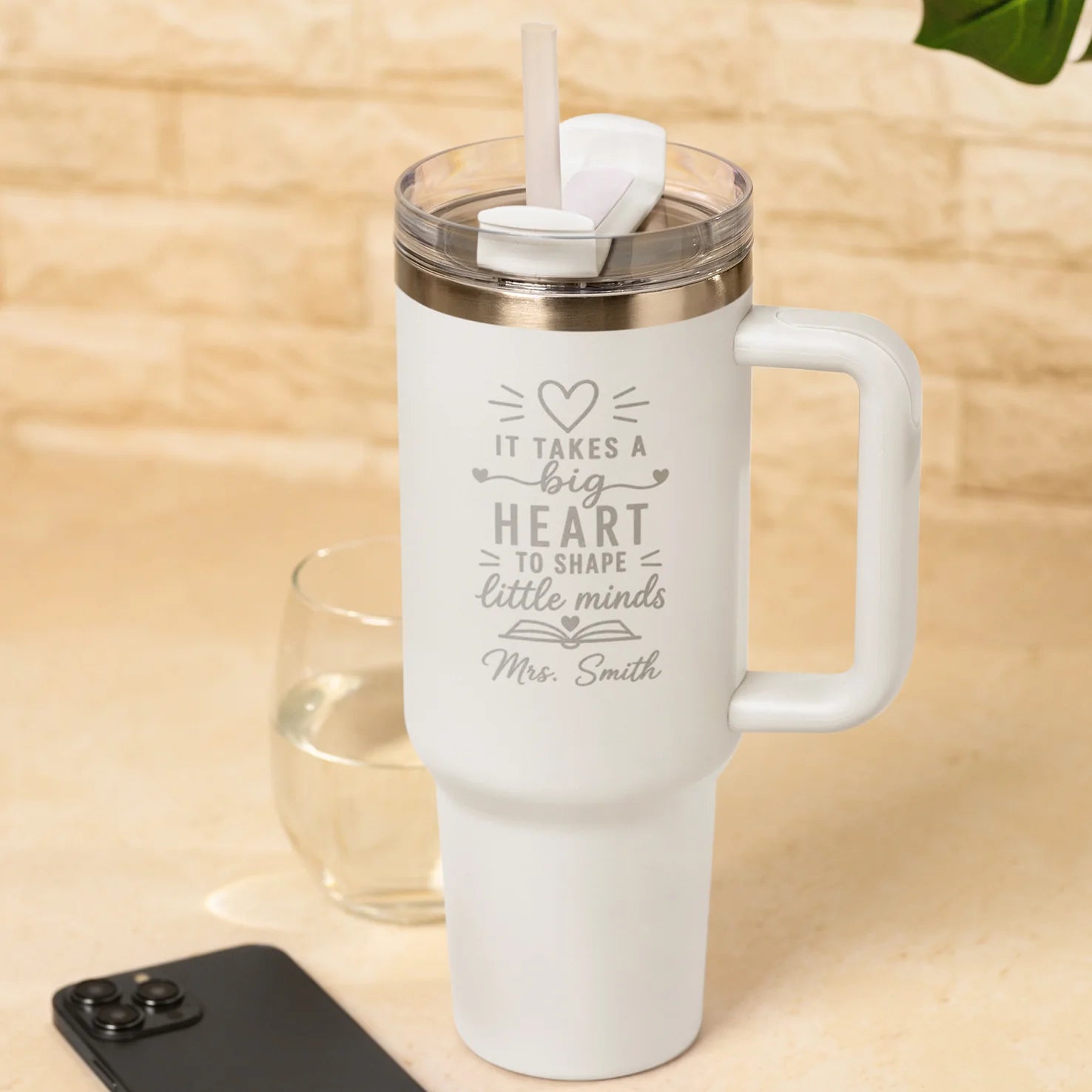 Personalised white insulated teacher tumbler with engraved It Takes a Big Heart to Shape Little Minds design and custom teacher name.