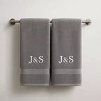 embroidered initials design on personalised couple towels

