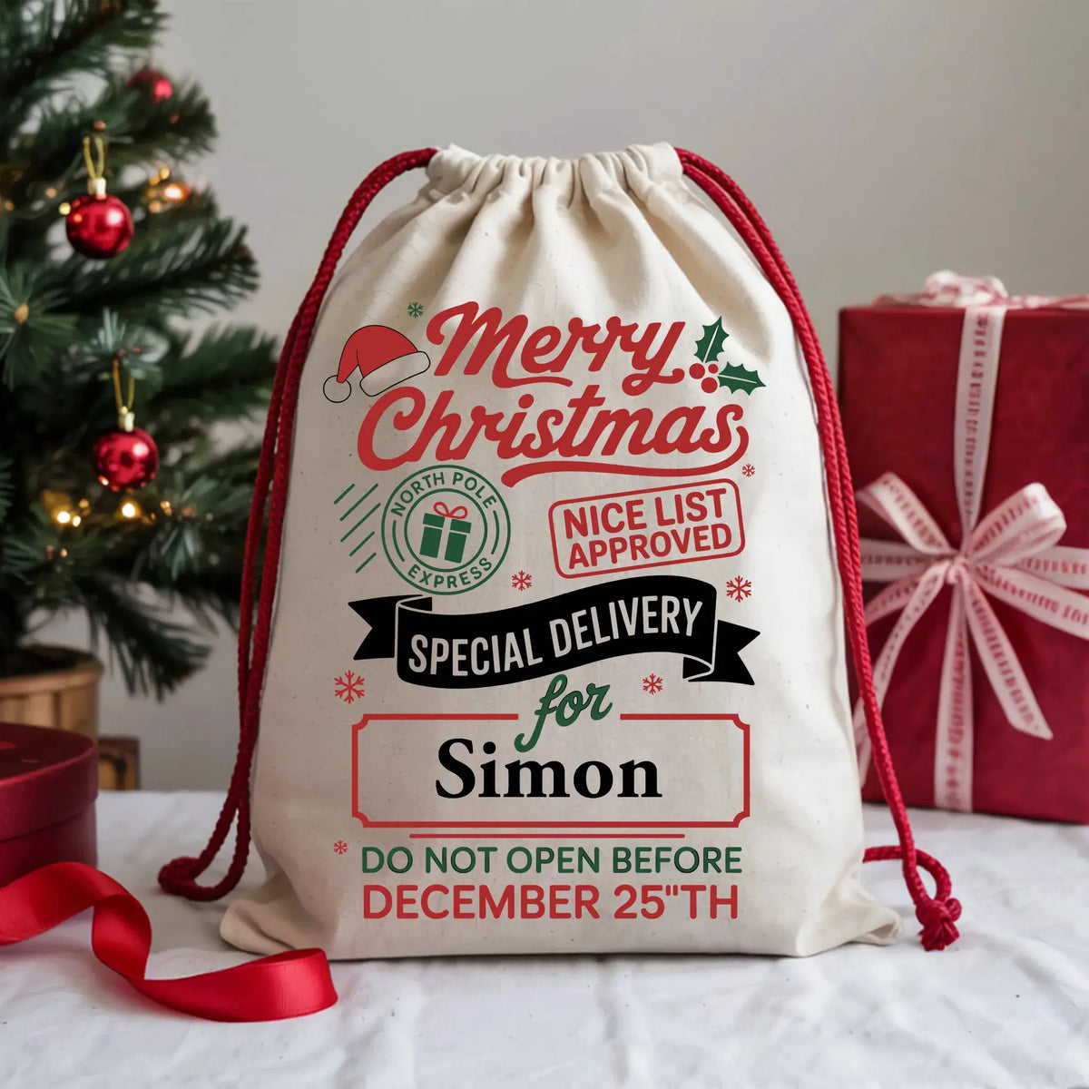 Personalised Merry Christmas Special Delivery sack with custom name, North Pole Express artwork, Nice List Approved badge and red drawstring.