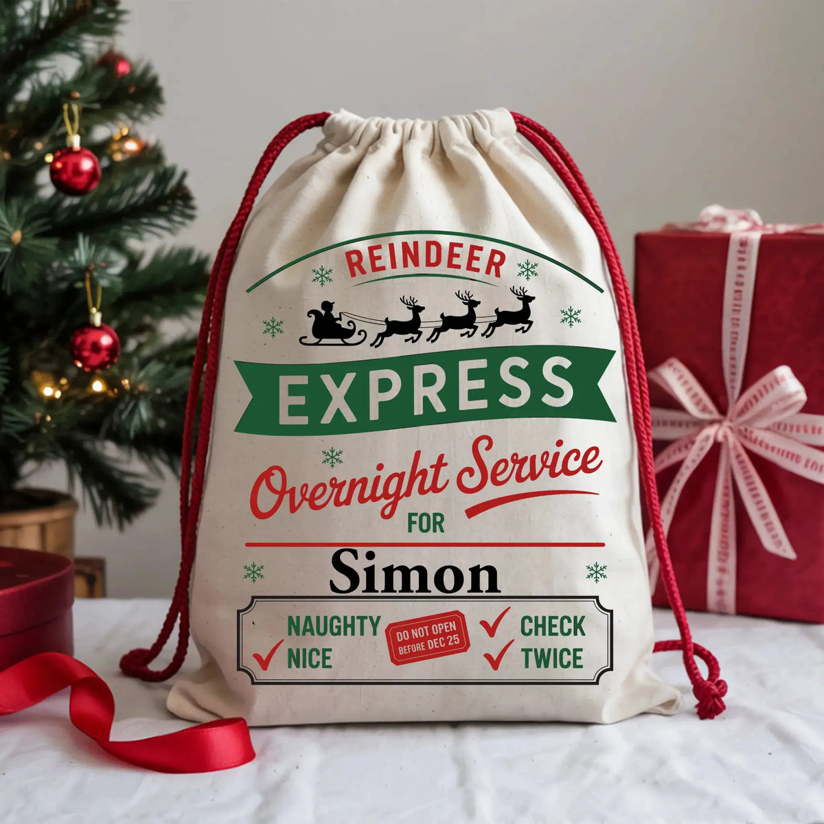 Personalised Reindeer Express Christmas sack with custom name, festive red and green artwork, reindeer silhouettes and North Pole overnight delivery design.