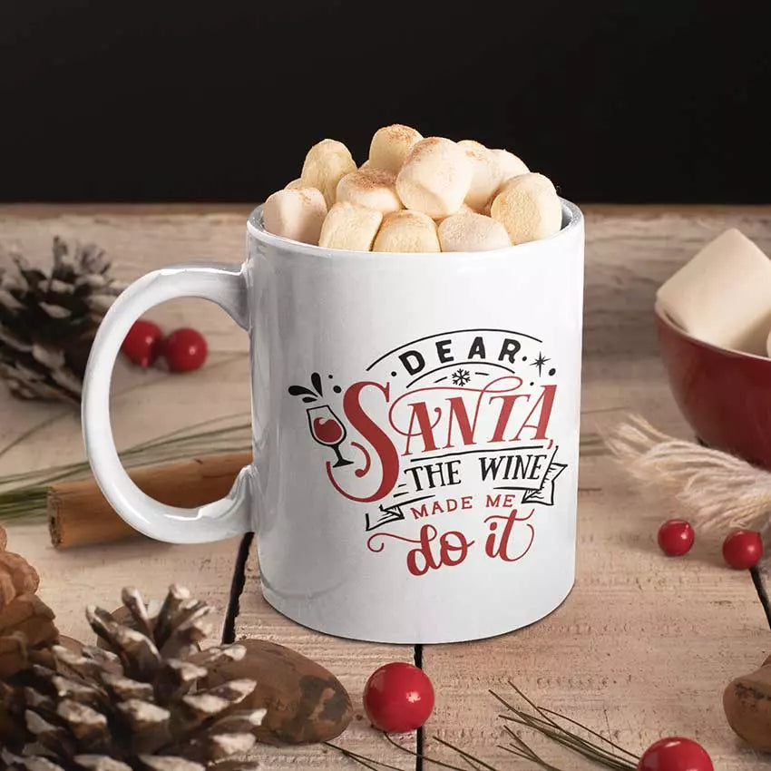 Funny Dear Santa The Wine Made Me Do It Christmas mug with a festive wine joke design on a white ceramic mug.