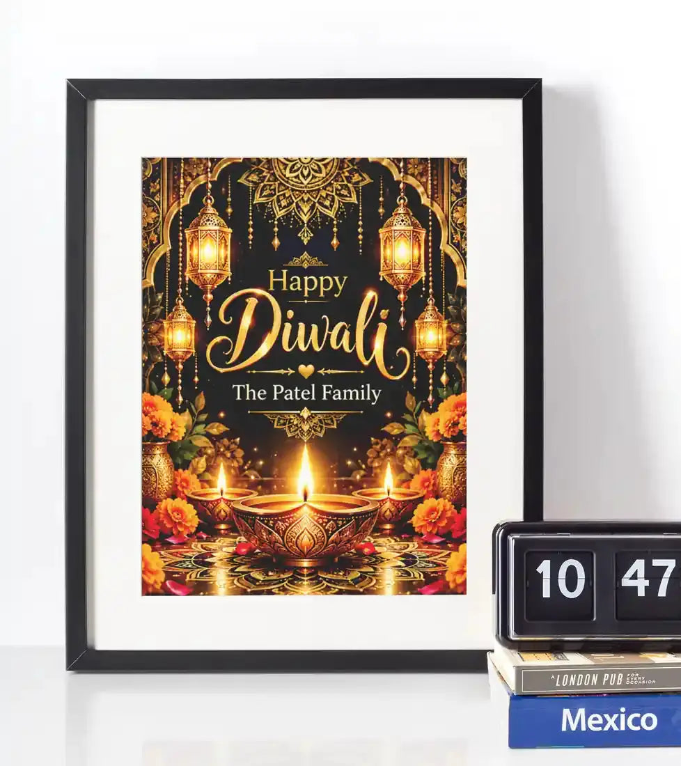 Personalised Happy Diwali family name wall art in a black frame, with gold festive lettering, illuminated lanterns, marigold flowers and ornate diya decorations.