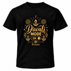Black personalised Diwali Mode ON T-shirt with gold diya and fireworks design, ON switch graphic and custom name underneath.