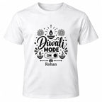 White personalised Diwali Mode ON T-shirt with black festive lettering, diya illustrations, ON switch and personalised name.