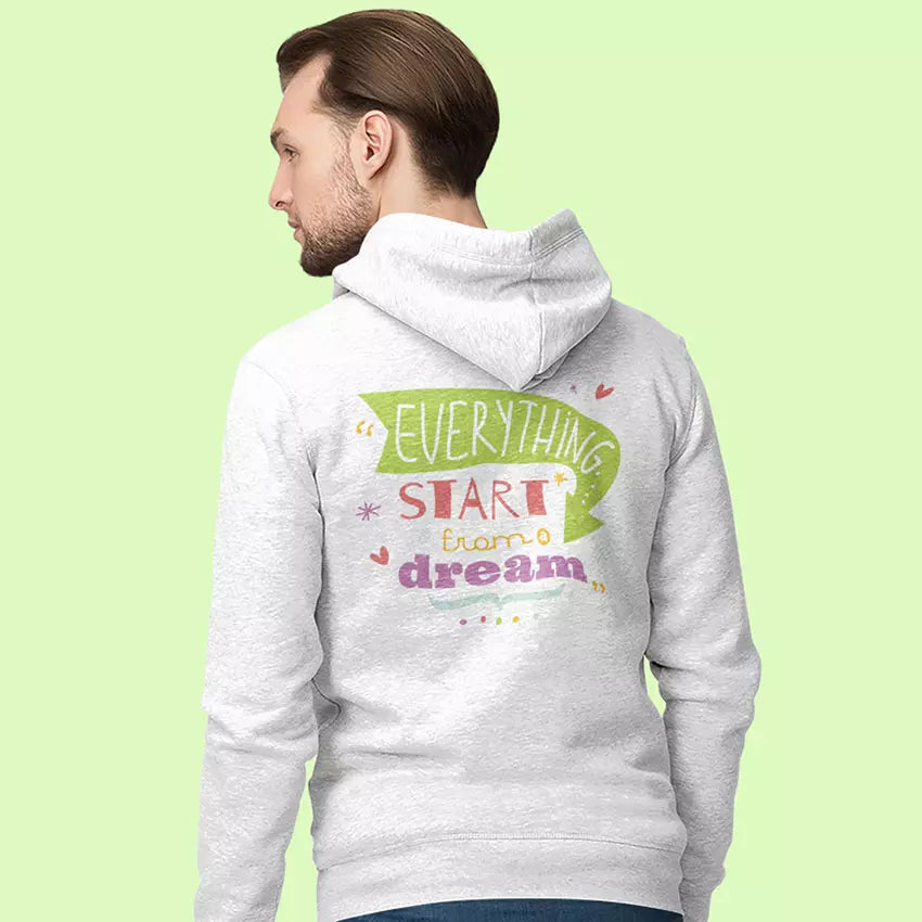 Person wearing a gray hoodie with motivational text on the back against a light green background