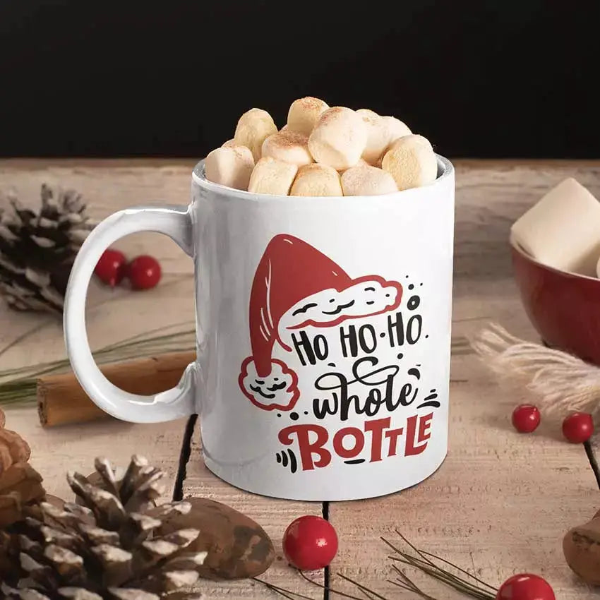 Funny Ho Ho Ho Pour the Whole Bottle Christmas mug featuring a cheeky festive wine joke on a ceramic mug.