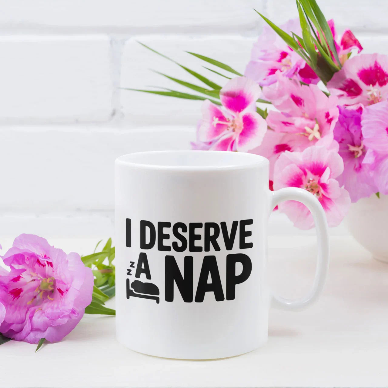 Funny ceramic mug with "I Deserve A Nap" quote, a relatable and humorous Mother's Day gift for tired mums, UK.