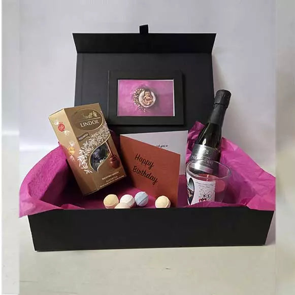 Luxury prosecco pamper hamper with Lindt chocolates bath bombs personalised candle and greeting card gift for birthdays and special occasions