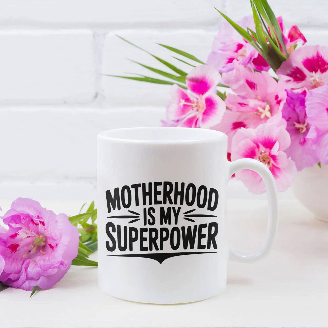 Empowering white ceramic mug with "Motherhood Is My Superpower" design, an inspirational Mother's Day gift for mums, premium finish UK made.