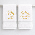 White luxury towels with gold embroidered Mr Right and Mrs Always Right names hanging in bathroom