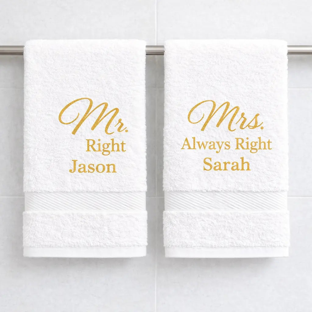 White luxury towels with gold embroidered Mr Right and Mrs Always Right names hanging in bathroom