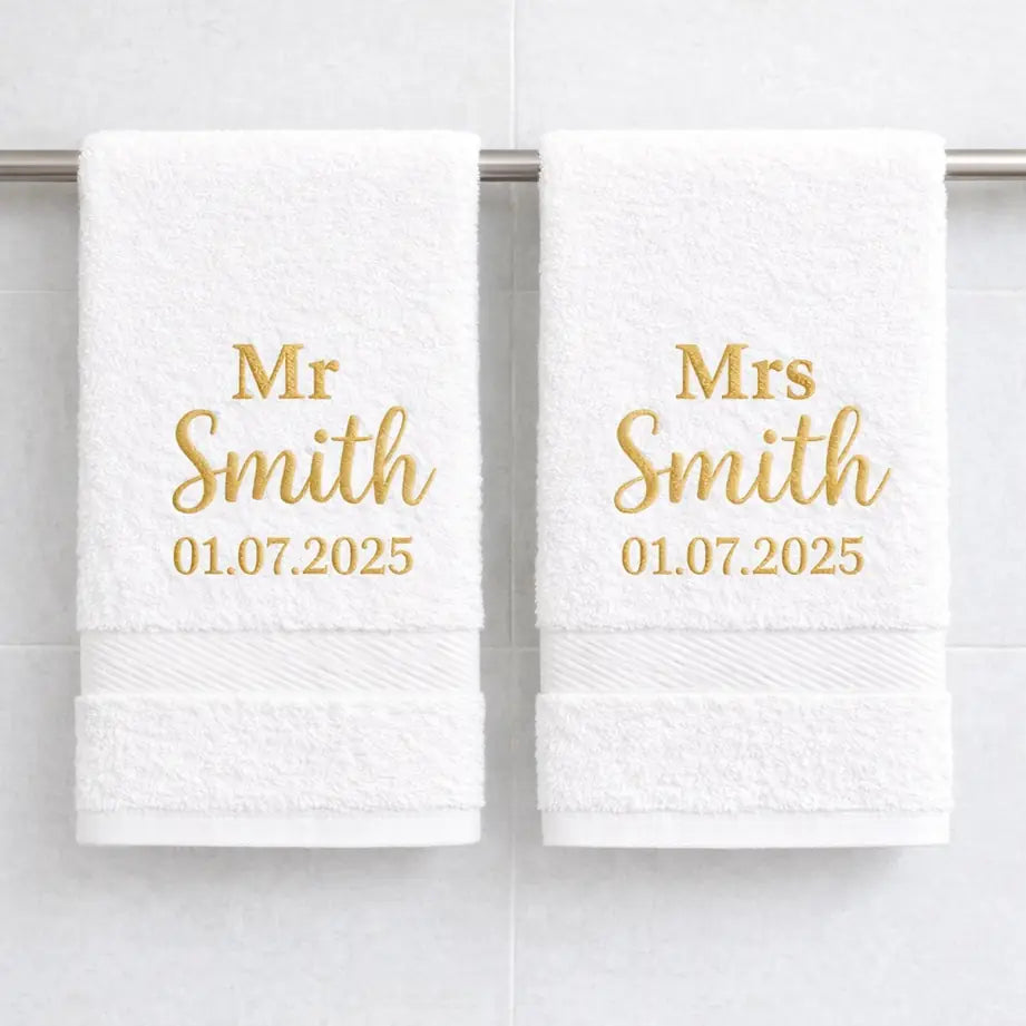 White luxury cotton Mr and Mrs towels with gold embroidered surname and wedding date in bathroom