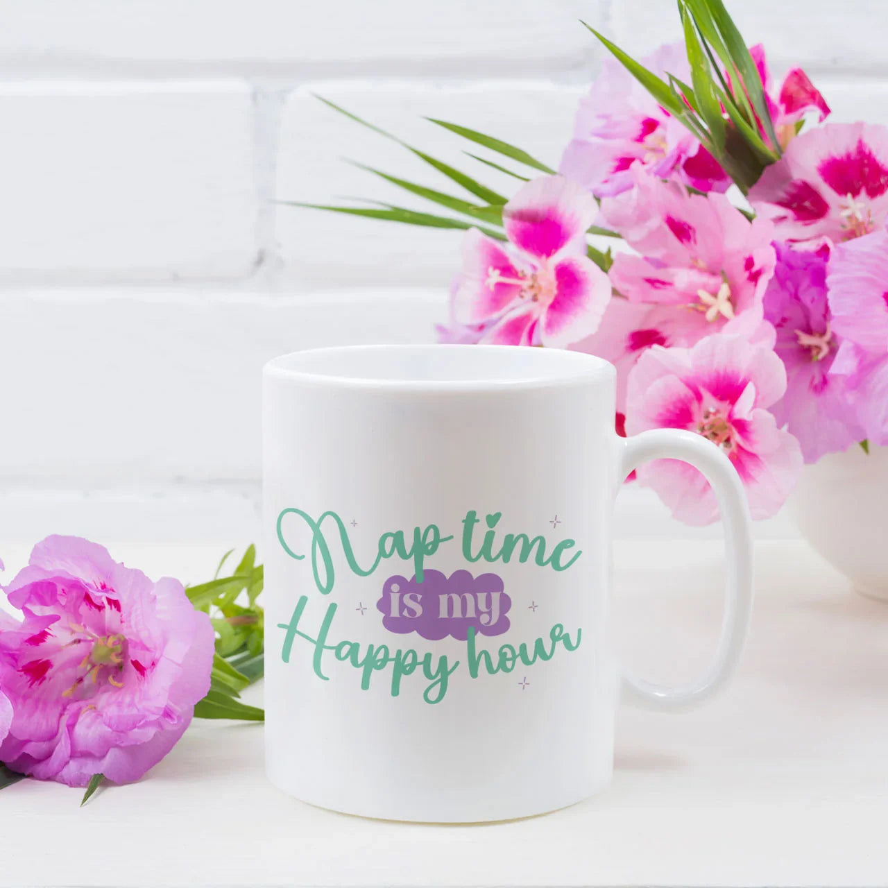 Funny ceramic mug with "Nap Time Is My Happy Hour" quote, a humorous gift for exhausted mums and new parents, high-quality coffee cup for Mother's Day UK.