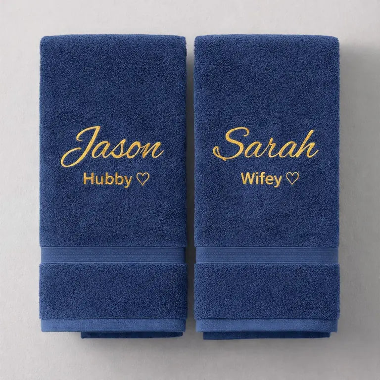 Navy blue personalised hubby and wifey towels with gold embroidered names and hearts