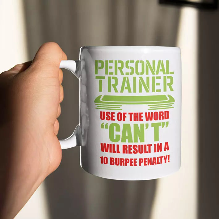 Personalised ceramic mug displaying the funny personal trainer warning “Use of the Word Can't Will Result in a 10 Burpee Penalty”.