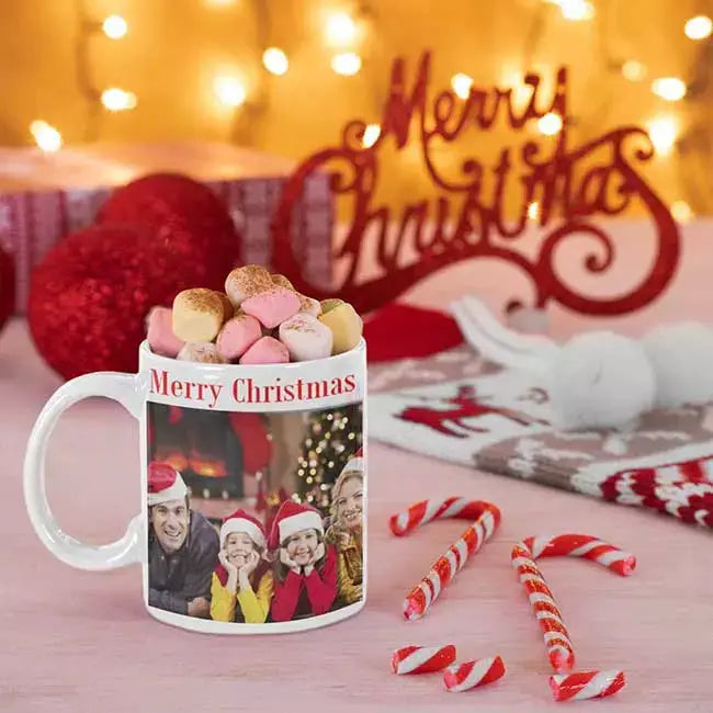 Personalised Christmas photo mug with a custom uploaded picture, recipient's name and festive design on a white ceramic mug.