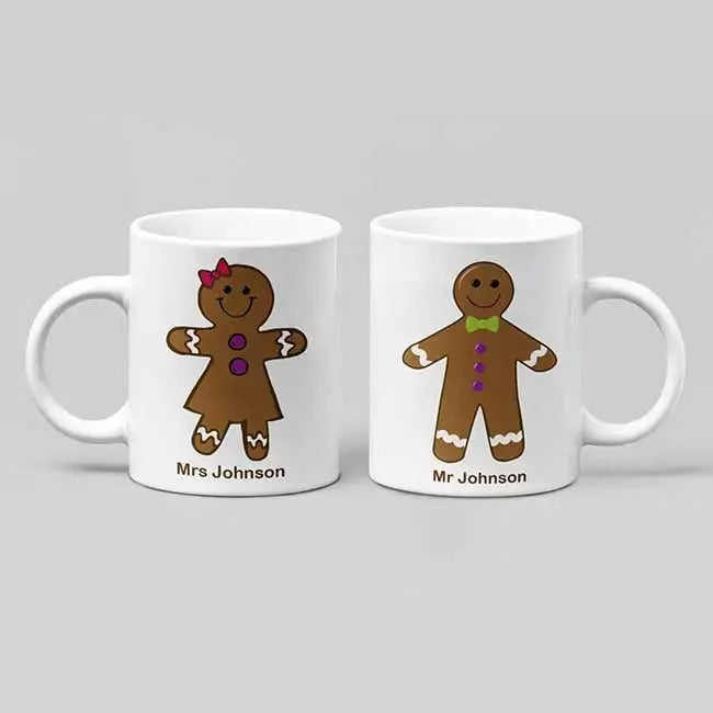 Personalised Gingerbread Man and Gingerbread Woman Christmas mug gift set featuring two matching ceramic mugs with individual custom names.