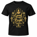 Black personalised Diwali T-shirt with gold “Good Vibes Bright Lights” lettering, diya, lanterns, fireworks and the name Rohan.