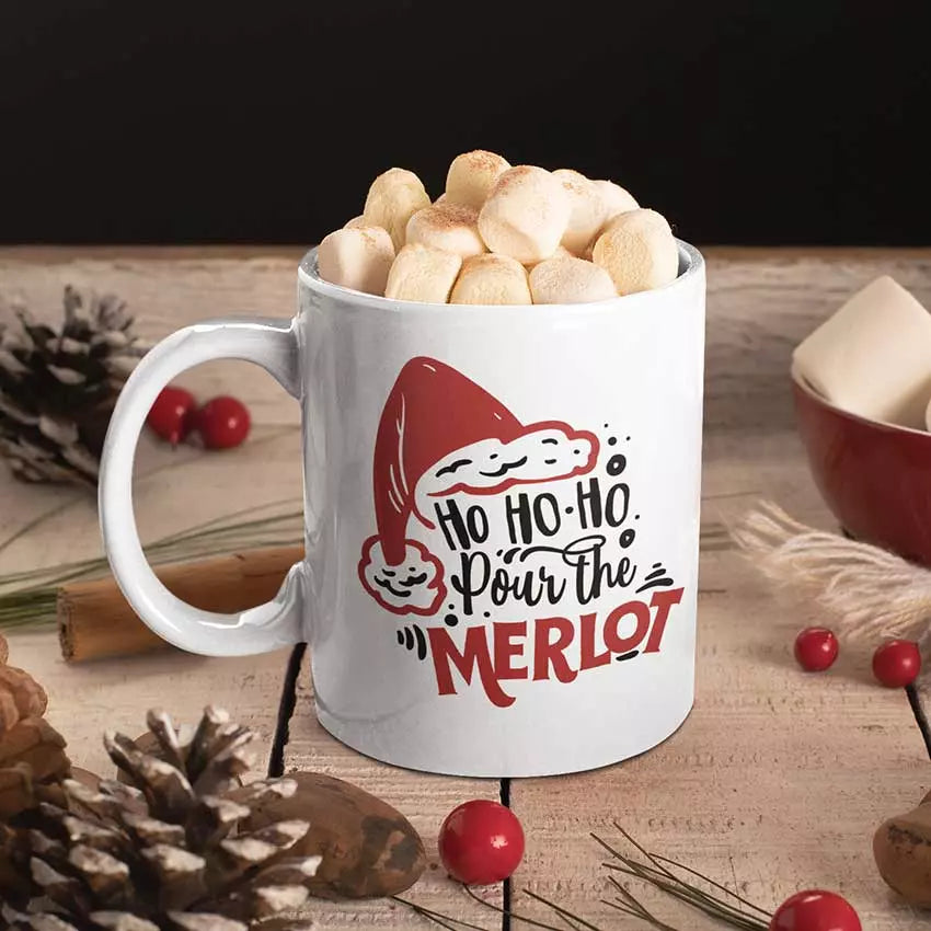 Personalised Ho Ho Ho Pour the Merlot Christmas mug with funny festive wine slogan on white ceramic mug.