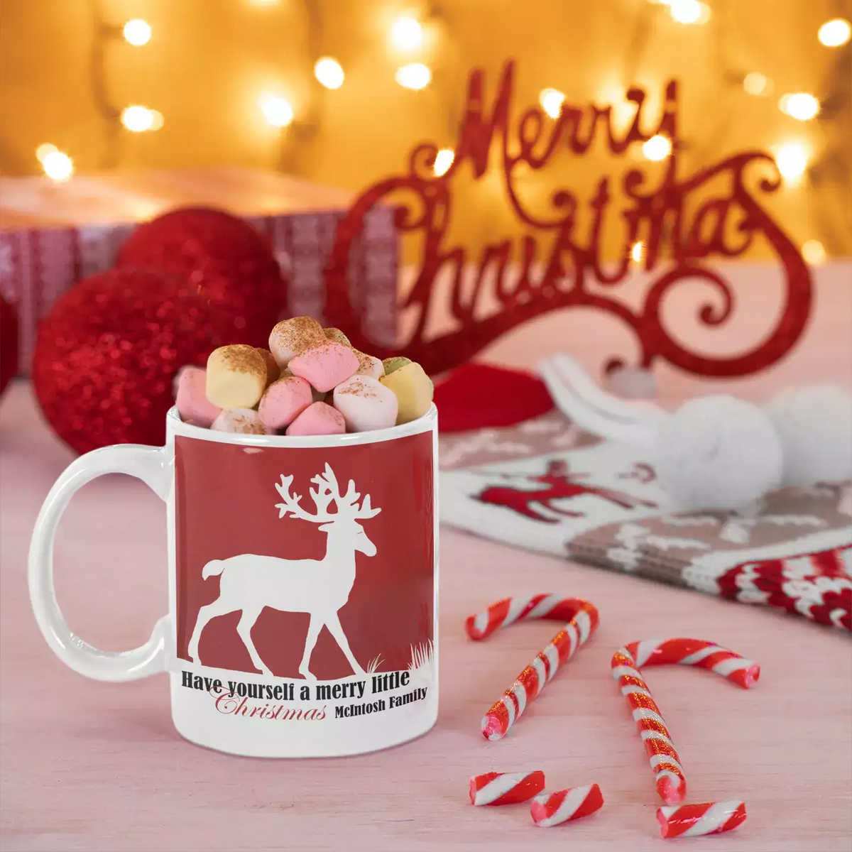 Personalised Merry Little Christmas ceramic mug featuring a festive Christmas greeting on a white mug.