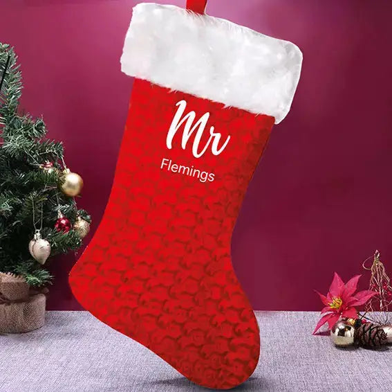 personalised Mr red velvet Christmas stocking with fluffy white trim, custom printed names and hanging loops.