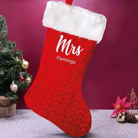 personalised Mrs red velvet Christmas stocking with fluffy white trim, custom printed names and hanging loops.