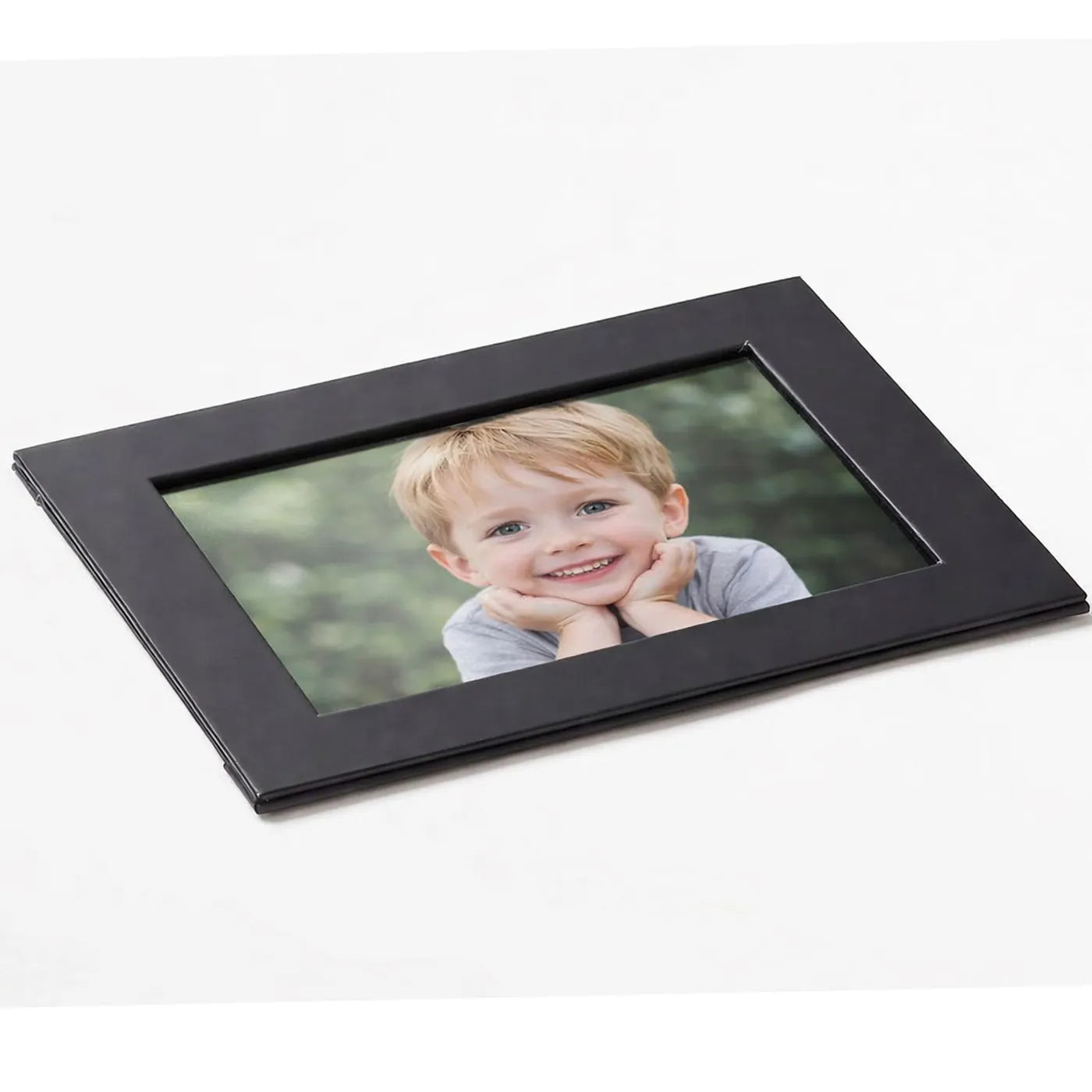 Personalised photo frame mockup with a cute child photo inside black matt frame, perfect personalised family photo frame gift for kids pictures, birthdays, family keepsake boxes and memory photo gifts.