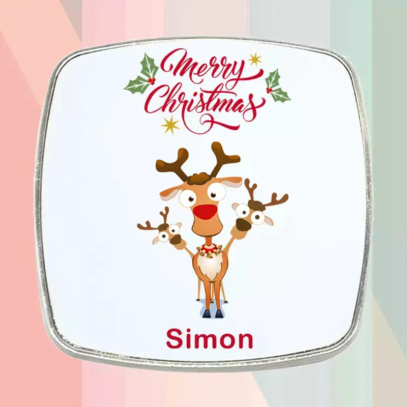 Personalised Rudolph Christmas fridge magnet featuring a festive reindeer design, custom printed name and square metal-edged finish.