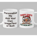 Funny Sorry Santa I've Been Nutty Christmas mug featuring a cute squirrel wearing a Santa hat decorated with colourful festive lights.