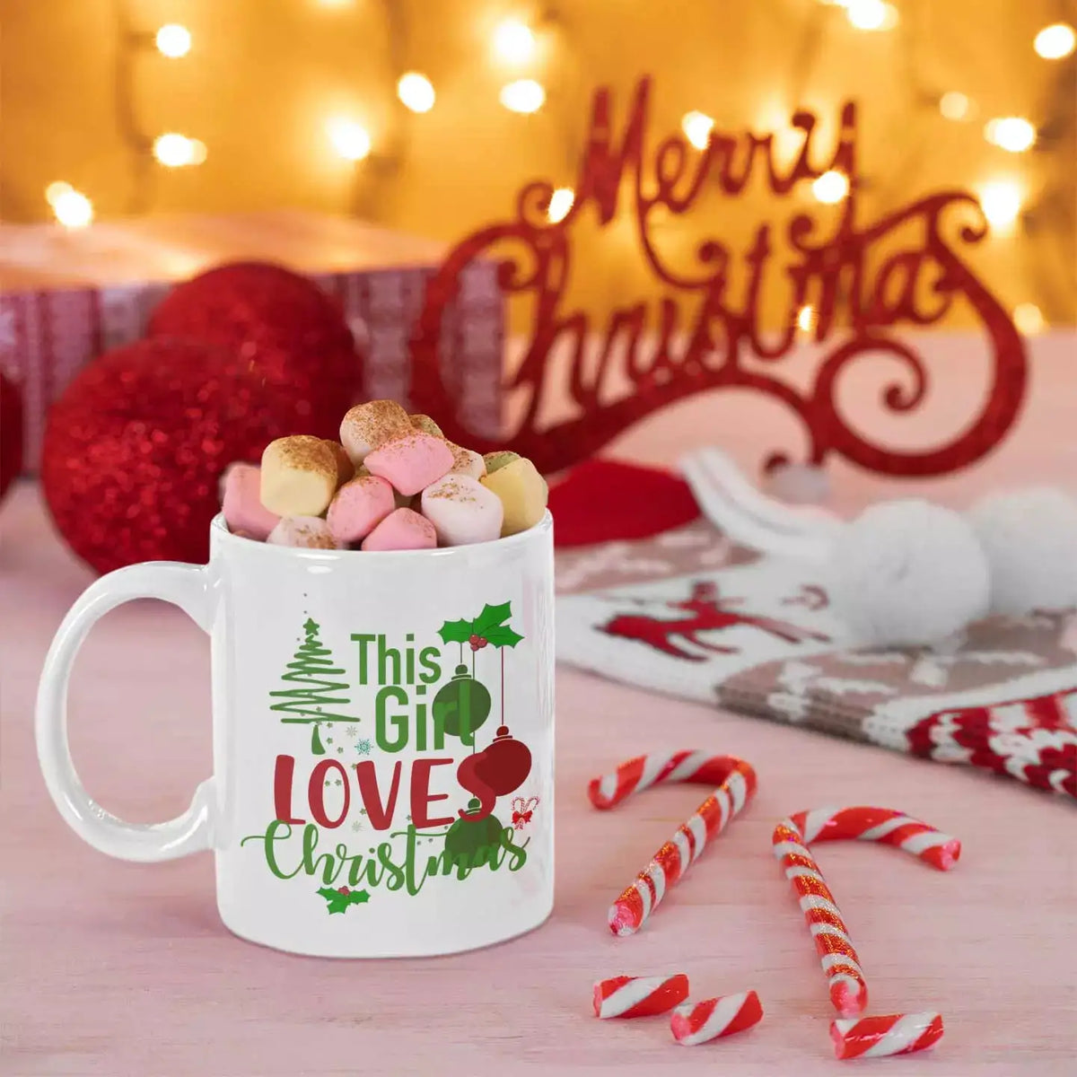 Personalised This Girl Loves Christmas ceramic mug with festive slogan design.