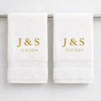Pair of white luxury cotton towels with personalised gold embroidery initials and special date