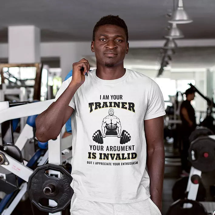 Personalised personal trainer T-shirt featuring the “I'm Your Trainer Your Argument Is Invalid But I Appreciate Your Enthusiasm” slogan with a custom name beneath.
