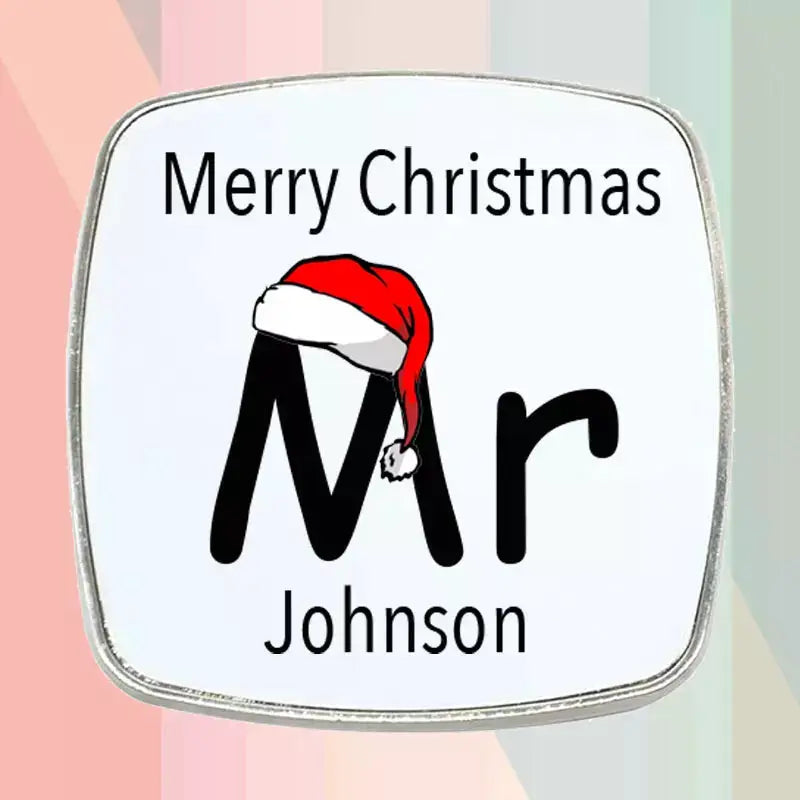 Personalised Mr Christmas fridge magnet gift set featuring two matching square magnets with festive Santa hats and individual custom names.
