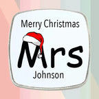 Personalised Mrs Christmas fridge magnet gift set featuring two matching square magnets with festive Santa hats and individual custom names.