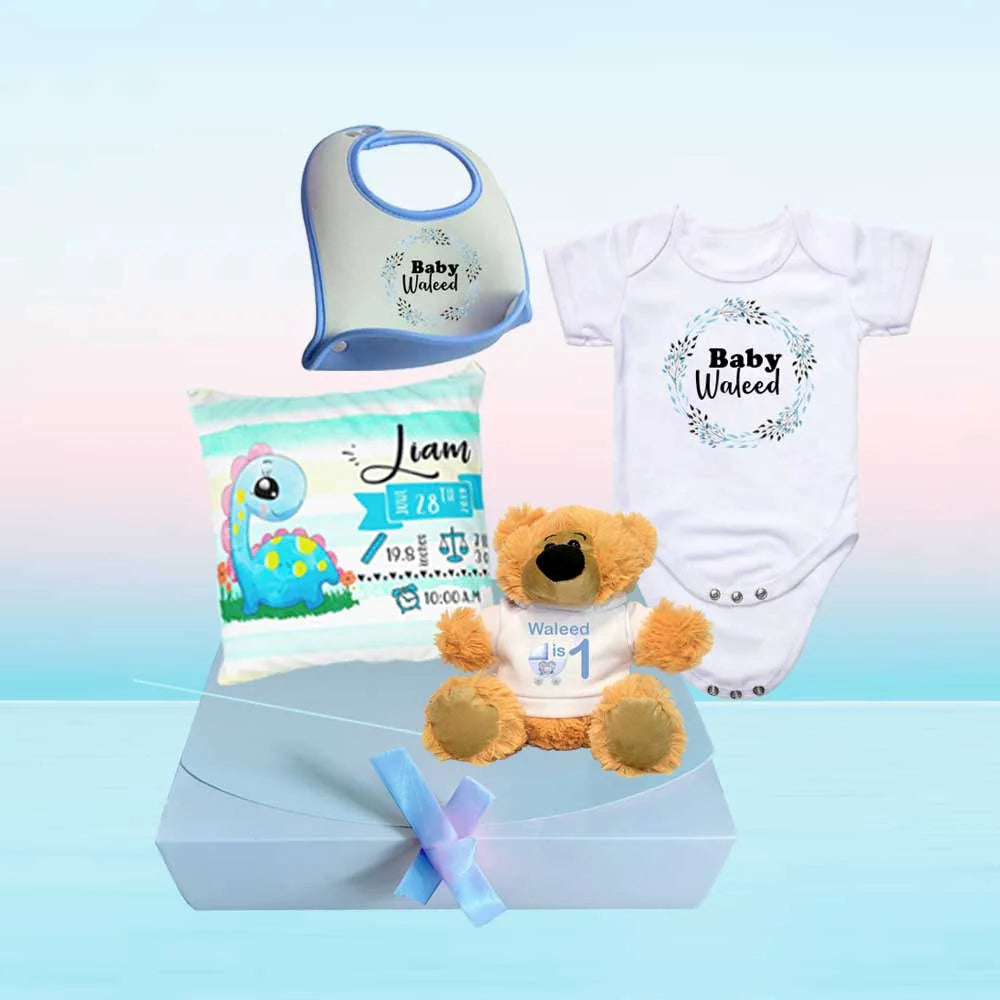 custom gift hamper for newborn with babygrow, teddy bear, bib and baby cushion