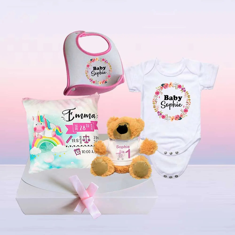 custom gift hamper set for newborn with babygrow, teddy bear, bib and baby cushion, personalised with name, age, date