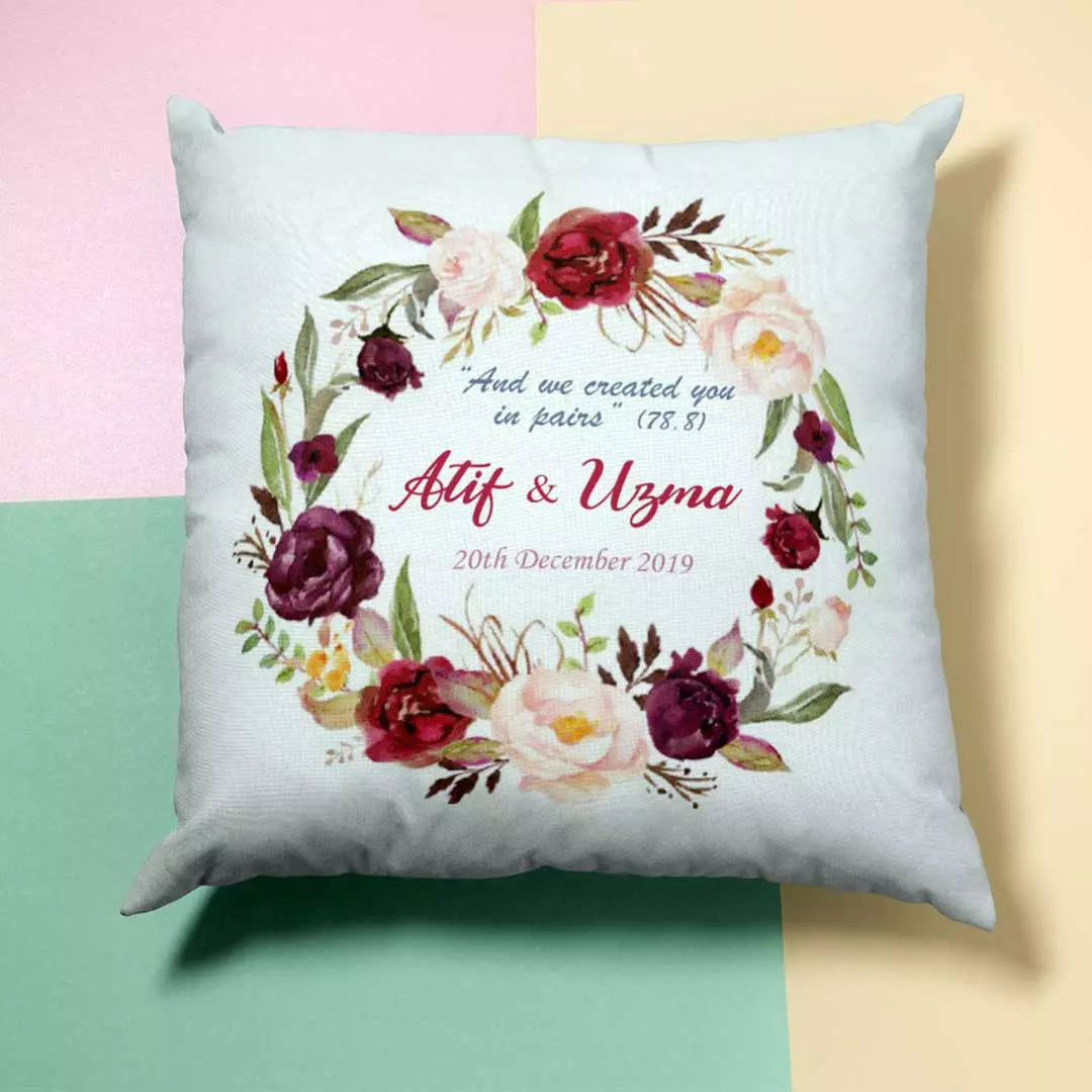 Custom decorative cushion with maroon white garland and personalised text