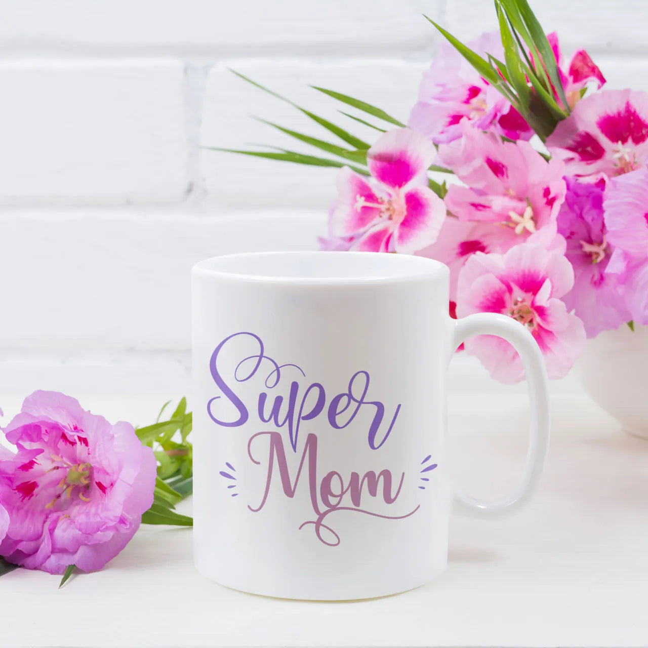 Personalised white ceramic mug with Super Mom design on front and custom family photo with name on the reverse