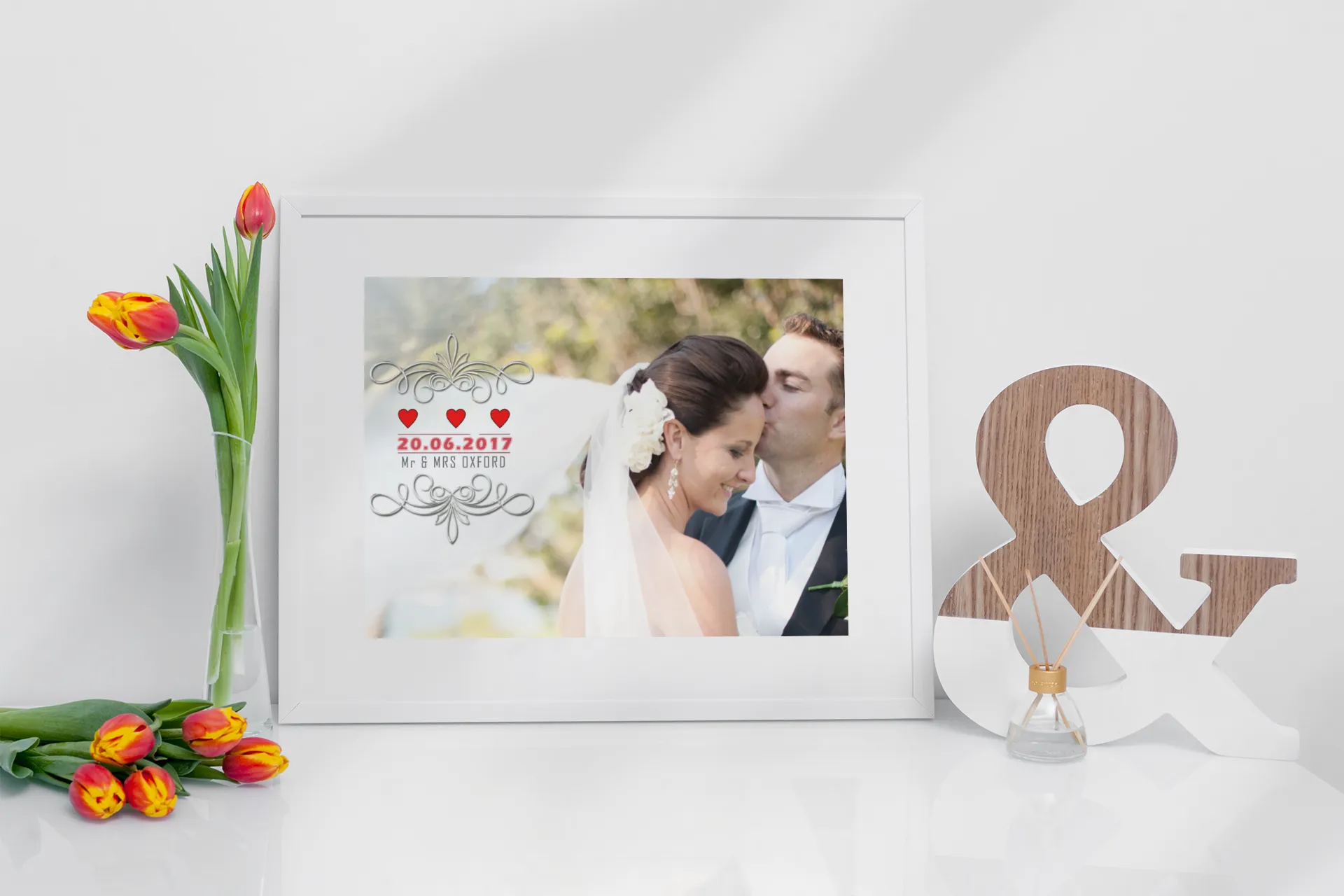 “Personalised wedding date photo frame with couple’s wedding picture, decorative flourishes, and custom date displayed on a white tabletop with tulips and décor.”