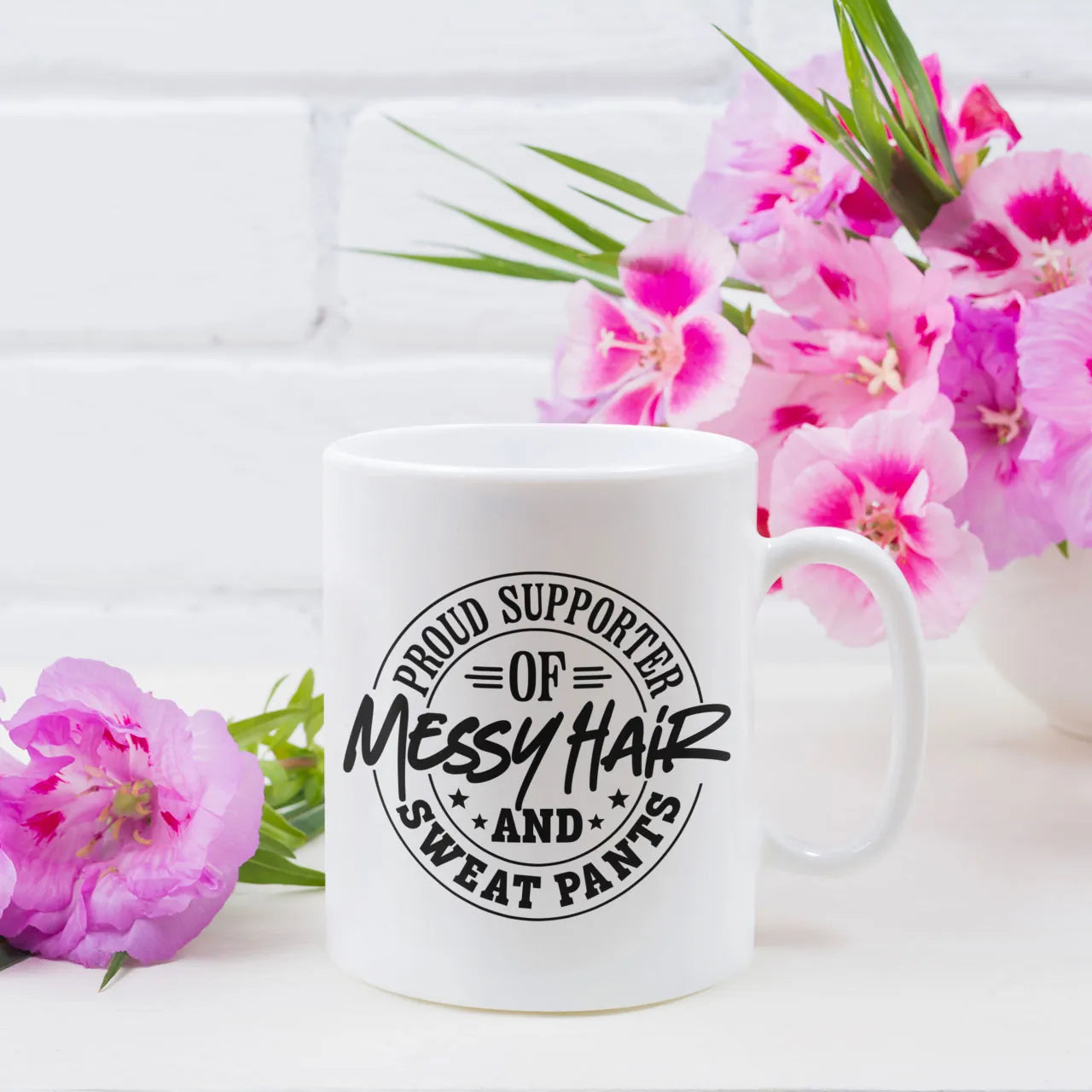 Funny ceramic coffee mug with "Proud Supporter of Messy Hair" text, a humorous and relatable Mother's Day gift for busy mums, high-quality white ceramic.